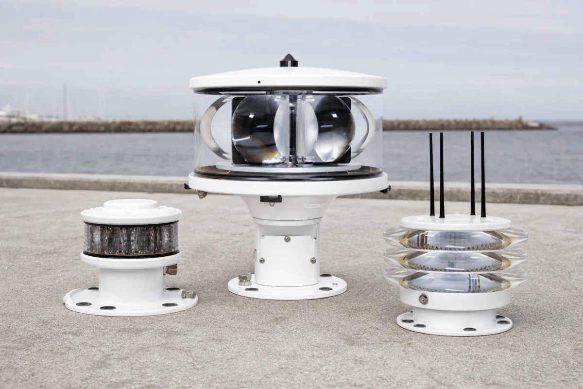 Three Beacons variants stand side by side on a pier, led by the taller central-spike model.