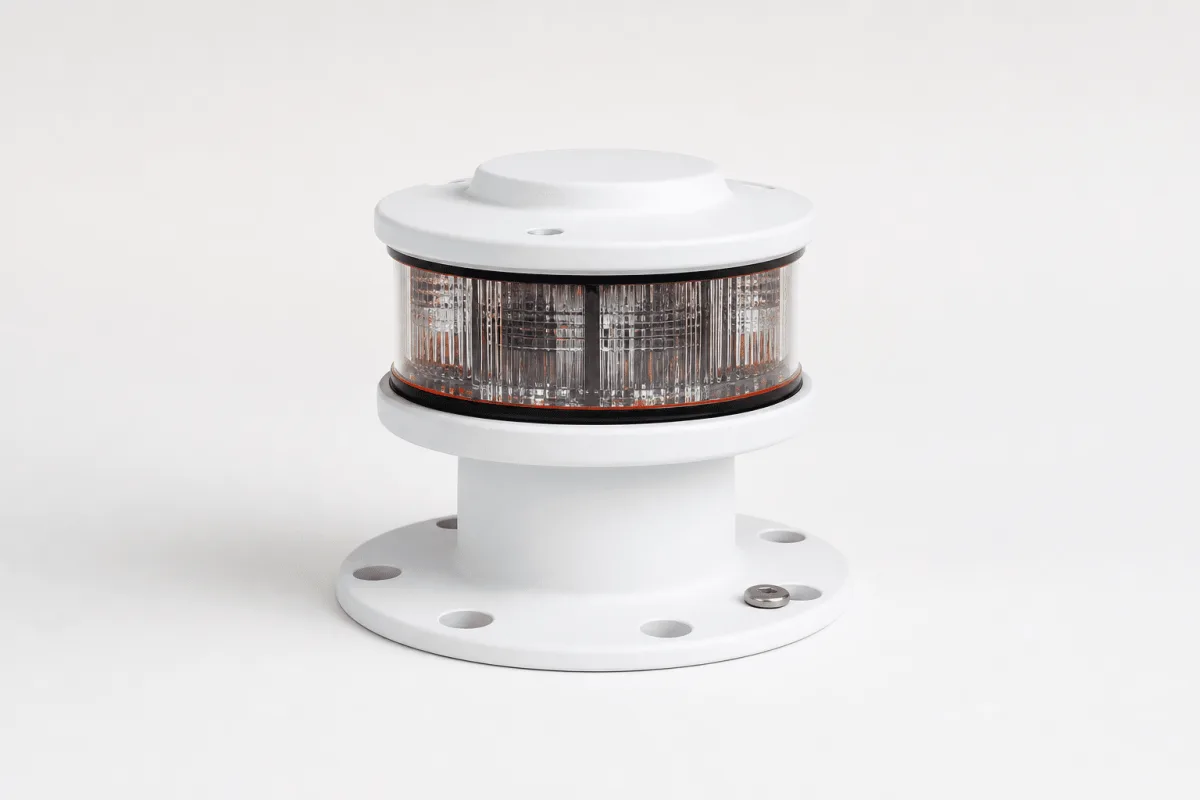 The compact Beacons pier beacon is shown in three-quarter view with its single ribbed lens ring and round flange.