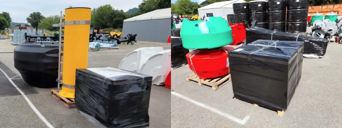 Navigation buoy components and packed equipment prepared for transport in an outdoor yard.